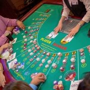 Baccarat table and players at the california grand at east bay