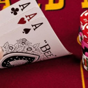 player playing 3 card poker in the East Bay Casino and holding a hand of 3 aces