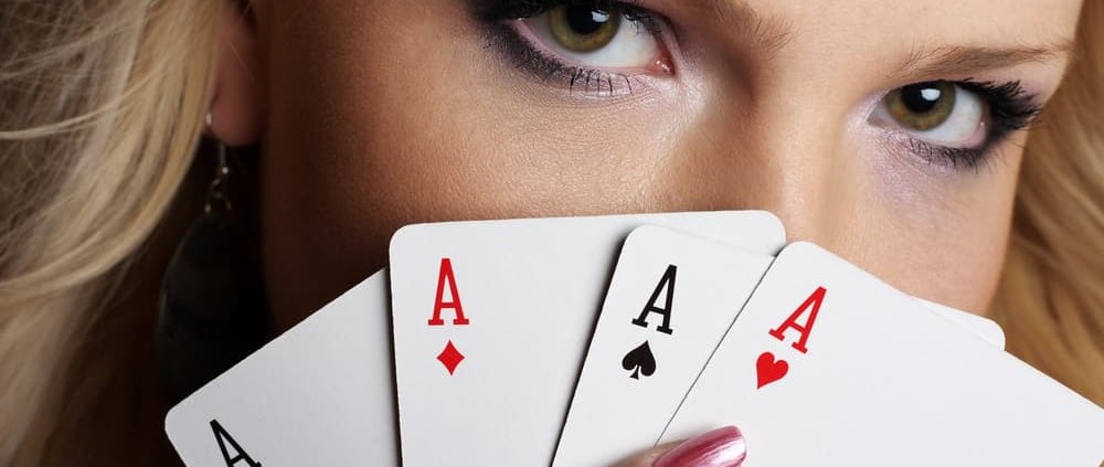 Girl's eyes and four cards