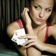 Girl with two cards at the californa grand casino in east bay