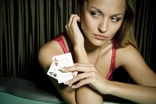 Girl with two cards at the californa grand casino in east bay