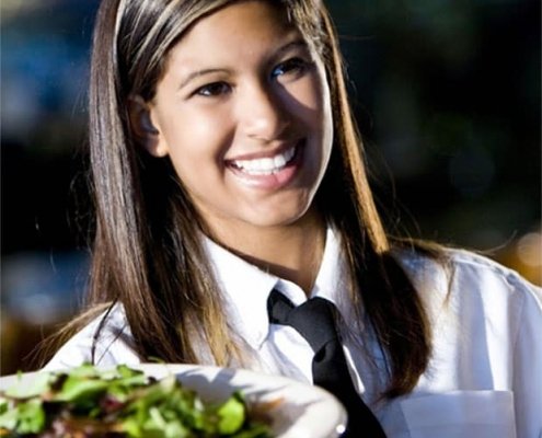 smiling waitress at the californa grand casino in east bay