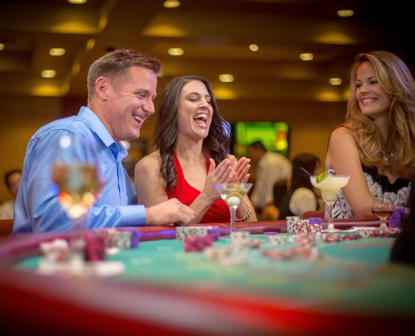 woman clapping at blackjact table at the californa grand casino in east bay